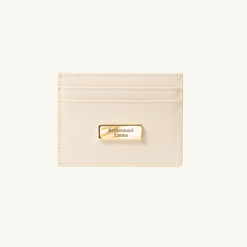 Beige cardholder with gold tag on a white background